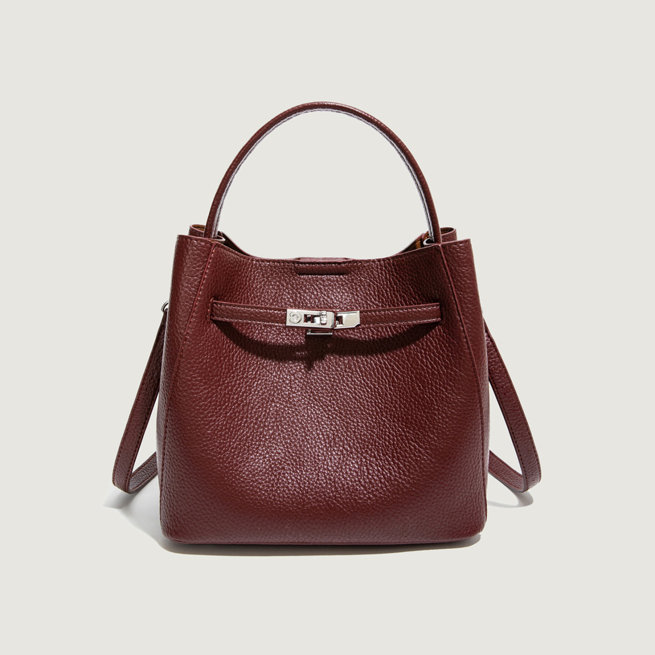 Bolso coreano de cuero suave litchi de gran capacidad de un solo hombro bolso de cubo 2025 nuevo bolso de cinturón de bloqueo para mujeres