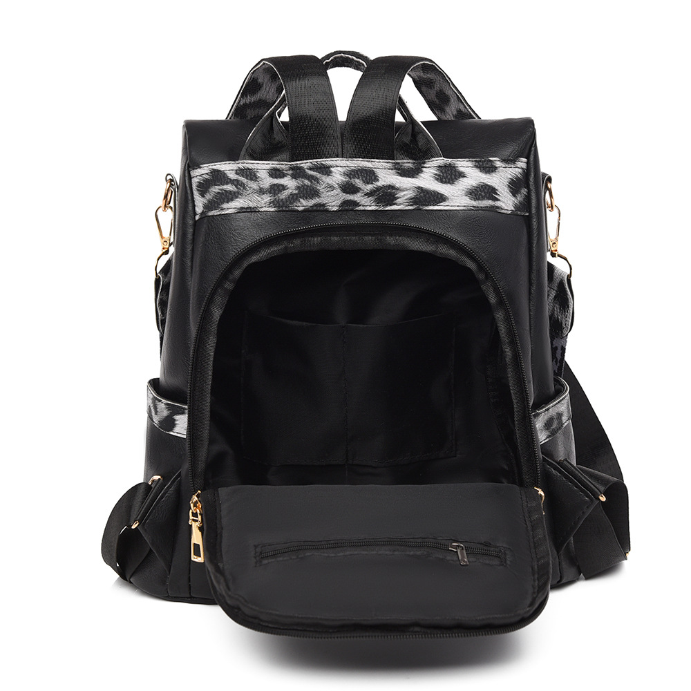 Fabricantes al por mayor 2025 nueva mochila de cuero suave para damas retro europeas y americanas moda estampado de leopardo contraste color bolso de mochila antirrobo