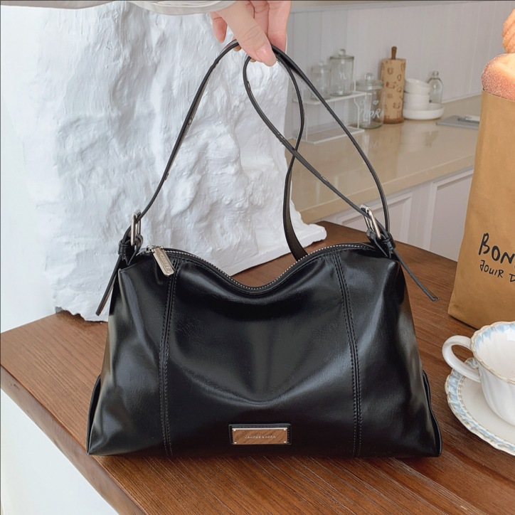 Transfronterizos retro bolsas de brazo de mano mujeres 2025 invierno nueva moda simple bolso de hombro universal mochila de viaje