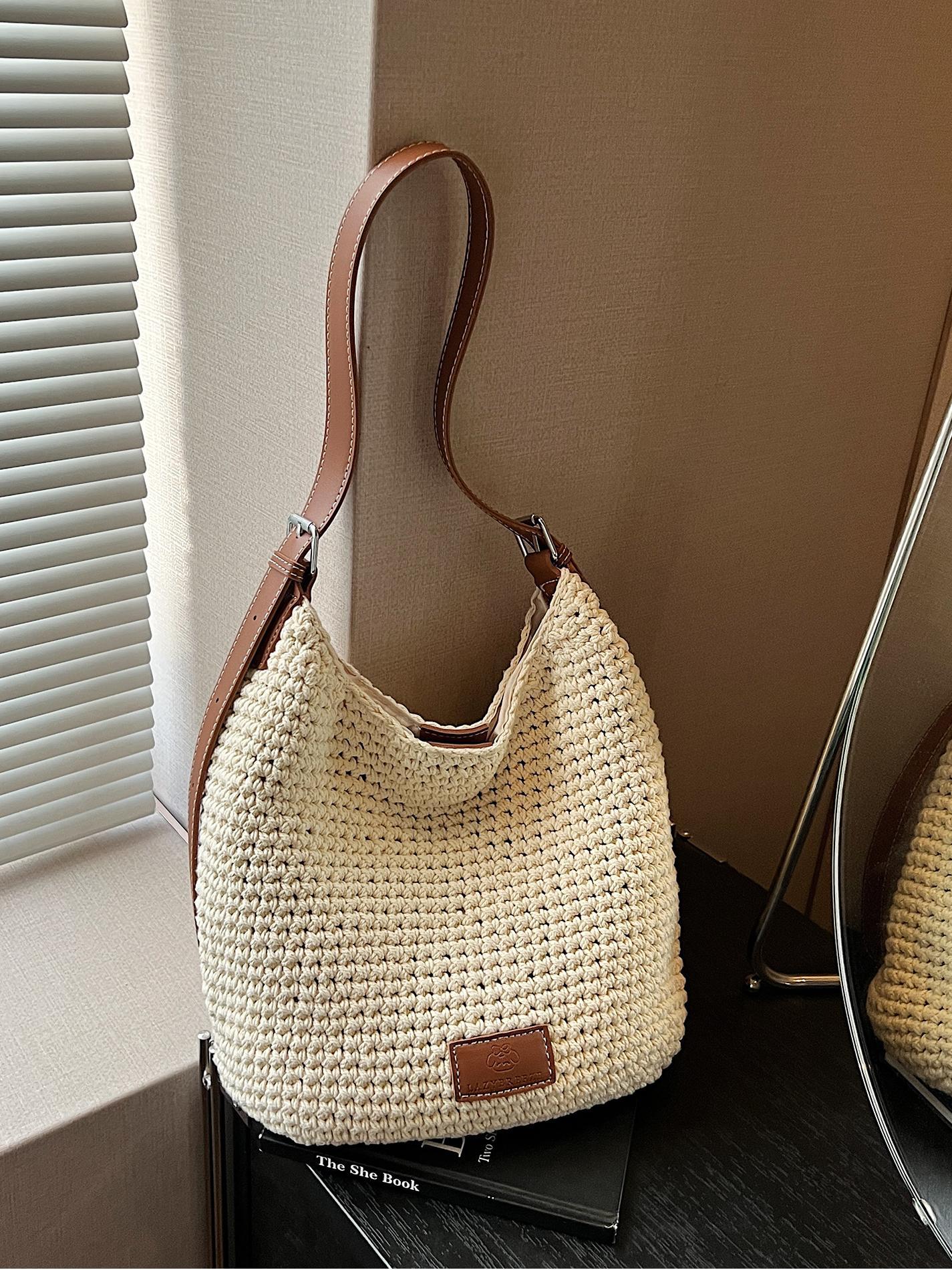 Bolso tejido hueco de estilo explosivo de verano para mujer de gran capacidad 2025 nuevo estilo de ocio junto al mar estilo vacaciones bolso tejido de paja de cercanías
