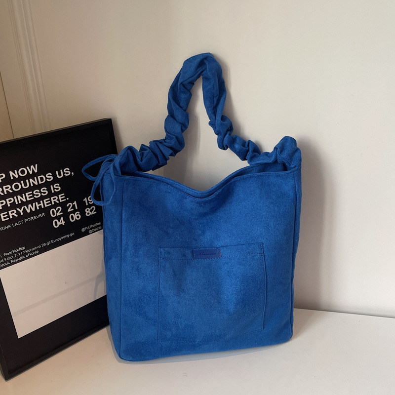 2025 otoño y invierno retro gaúster bolsas de balde de agua de mujer ocio versátil bolsas tote de gran capacidad plegadas mochila de hombro