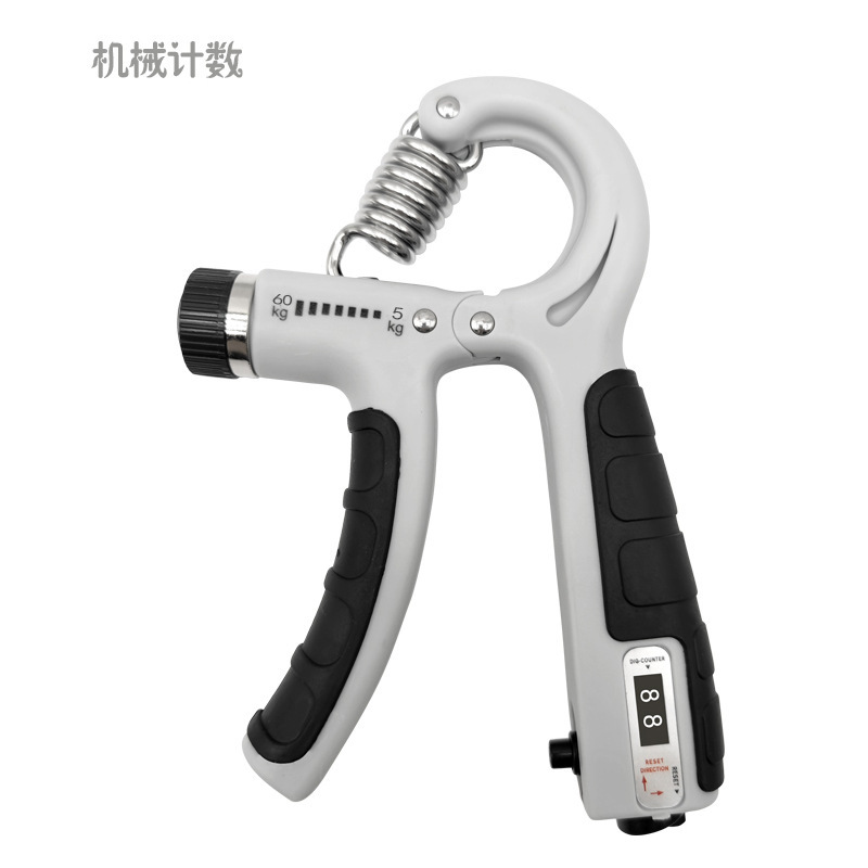 握力器は腕の男性の専門力のフィットネスの器材を練習します。|undefined