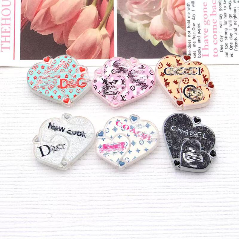 High-definition through-hole creative heart-shaped luxury brand logo acrylic embossed bead pen handmade accessory mobile phone chain bead