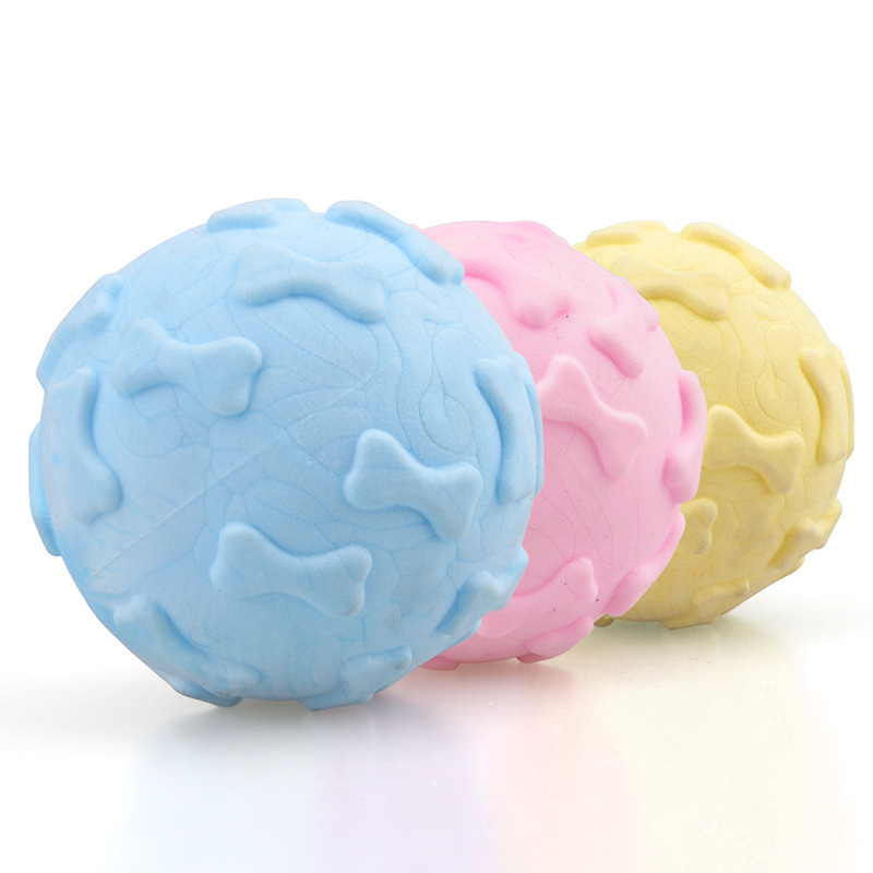 Juguete para mascotas transfronterizo TPR Bola de hueso de espuma mordedura molar sabor a leche bola sólida fábrica de juguetes para perros