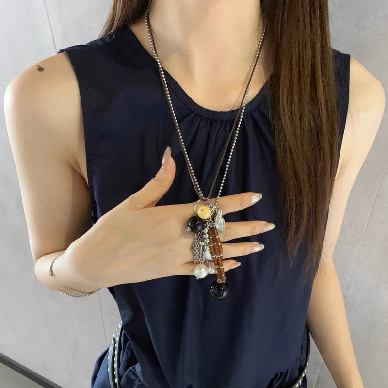 レトロなデザインの女性用ロングペンダントネックレス、ボヘミアンエスニックスタイルのビーズ鎖骨チェーン、積み重ねセーターチェーン|undefined