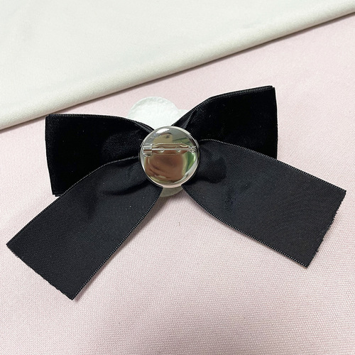 Vintage brocade ribbon butterfly knot camellia brooch with a touch of elegance, suitable for various occasions.
