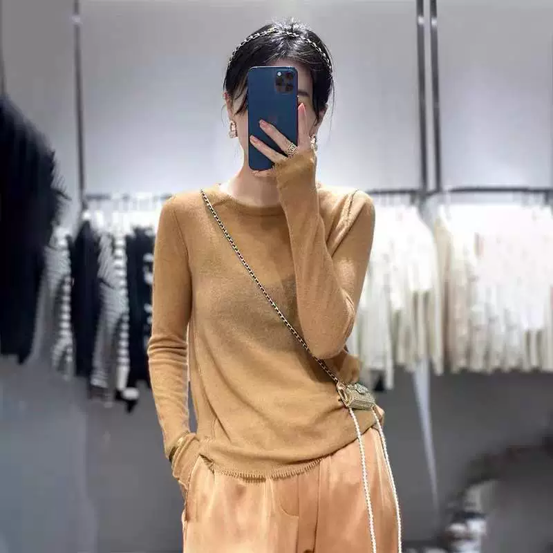 Woolen knitted winter sweater with a round collar