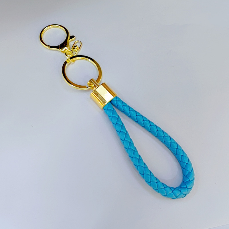 Ronda de la langosta hebilla PU cuero trenzado cuerda llavero hombres y mujeres amor llavero mano cuerda bolsa cordón fábrica directa al por mayor