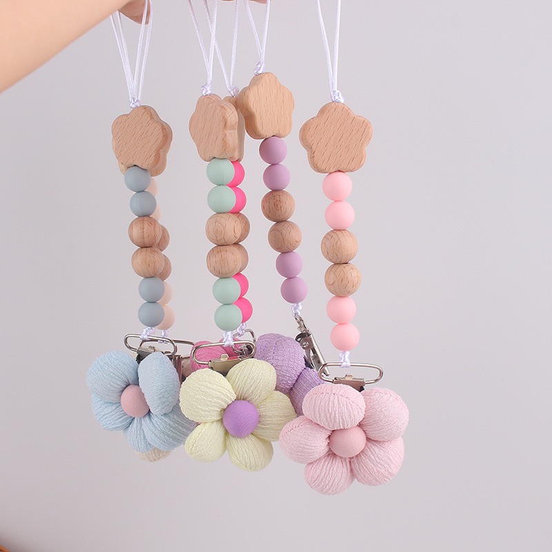 Productos para bebés pacificadores de tetas anti-caída cadena INS cadena de diente de viento flor de madera