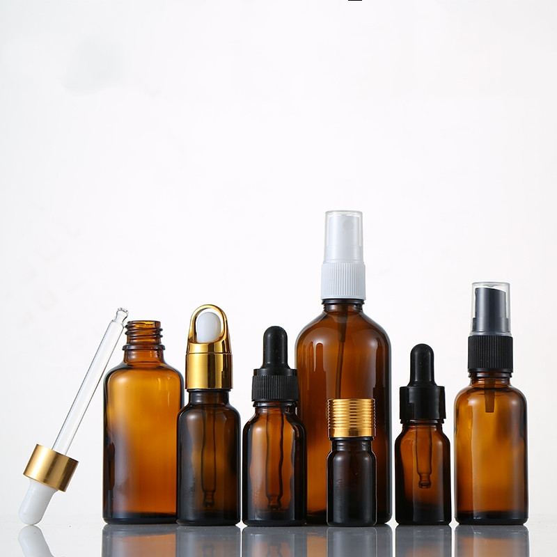 厂家批发化妆品玻璃瓶多款盖子茶色包装按压深色棕色分装精油瓶