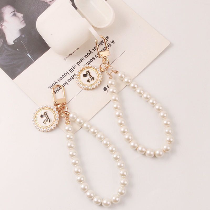 Cadena de perlas caja de teléfono móvil pequeña cadena de viento de fragancia nueva pulsera corta muñeca delicada colgante de mujer portátil