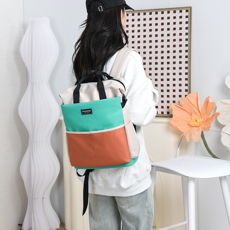 Bolso de mamá para madres y bebés de gran capacidad de estilo occidental, bolso de cercanías de almacenamiento de color en contraste de moda, mochila portátil multifuncional de un solo hombro