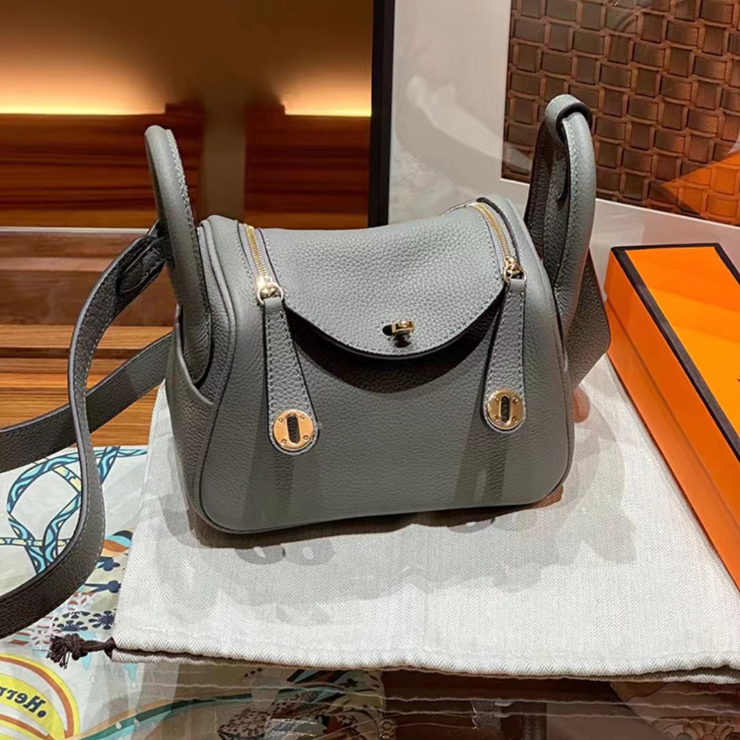 Bolsos de cuero Lindy de piel de vaca con togo de primera capa 2025 Bolsos de cubo retro de estilo europeo y americano Bolsos portátiles de moda