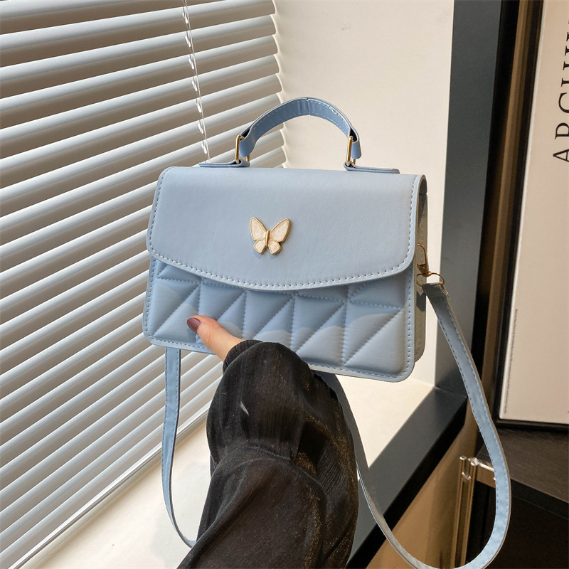 Bolsas para mujeres 2024 verano nuevo diseño de nicho de mariposa de alta calidad estilo de moda de diamante universal de hombro pequeño bolso de moda