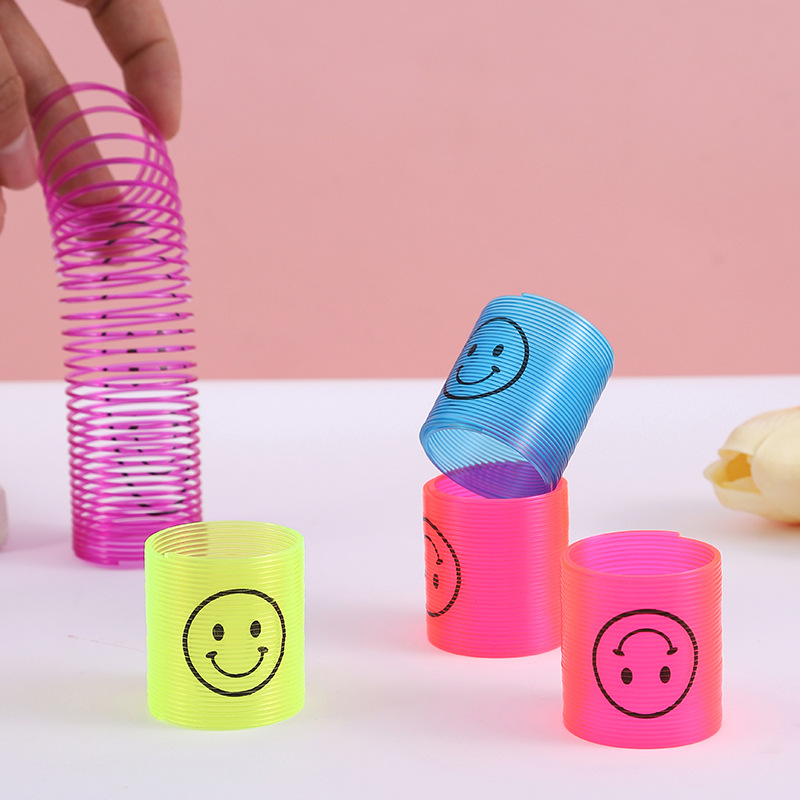 Nuevo 3.2 * 3.5cm sonriente transparente pequeño arco iris bobina de plástico para niños juguetes plegables