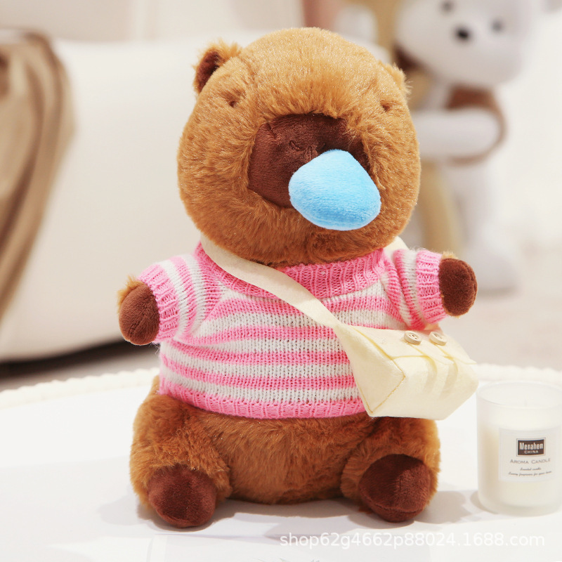 핑크 흰색 줄무늬 스웨터와 흰색 가방