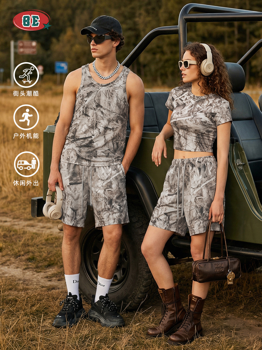 El kit| Verano americano camuflaje de transferencia térmica pareja chaleco camiseta de mangas cortas hombros inclinados pantalones cortos set hombre y mujer