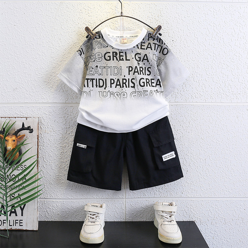 7147 Traje de verano para niños Traje de dos piezas de verano para niños de manga corta casual de Internet rojo bebé de moda de moda nueva 2025