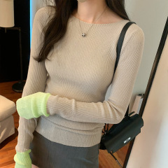 ヨーロッパの商品の独特なデザインのシックな長袖の色のニットのセーターの女性の秋冬の新型の修身はやせています。