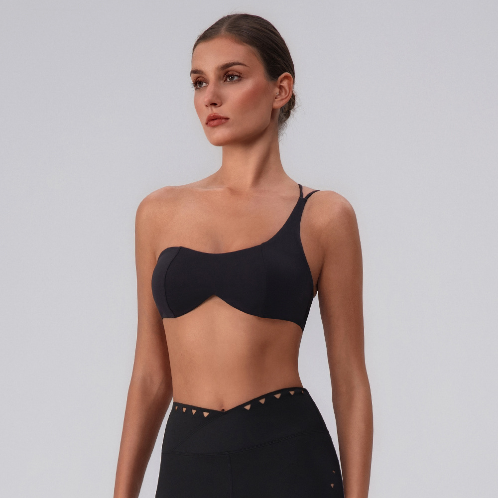 Sujetador de yoga hueco europeo y americano, almohadilla para el pecho desmontable de secado rápido, ropa interior deportiva, ropa de fitness Pilates, top de un hombro para mujer