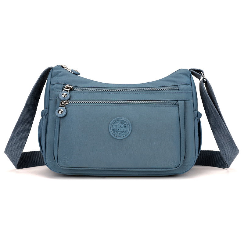 Bolsos bolsos para madres de mediana edad y ancianas 2024 nuevo bolso de mensajero de un solo hombro de tela de nailon bolso de bola de masa casual de viaje bolso de mujer