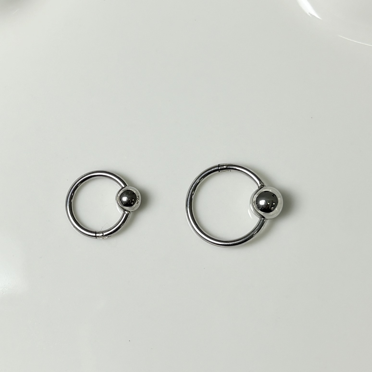 Silver pointed spike labret stud material detail