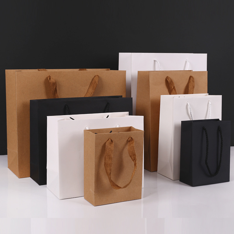 Thickened Kraft paper bag spot wholesale gift hand bag clothing store clothes paper bag printed logo tote bag manufacturers