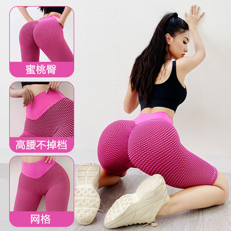 Panal europeo y americano sin costuras melocotón cadera pantalones de yoga de cinco puntos cintura alta estiramiento cadera medias deportivas Levantamiento de cadera pantalones de fitness