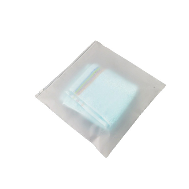 Bolsa de embalaje cabeza de tracción de la ropa de bolsillo sellado transparente en stock PE transparente esmerilado cremallera bolsa al por mayor calcetines embalaje independiente