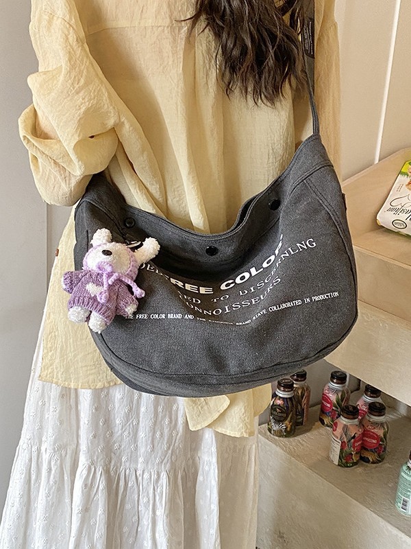 Bolsa de lona para mujeres 2026 nueva bolsa de gran capacidad transfronteriza impresa letras de viaje casual mochila de hombro