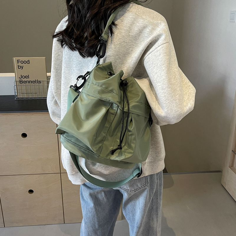 帆布包包韓系高級感百搭水桶包春夏2024新款小眾寬帶斜挎包女手提
