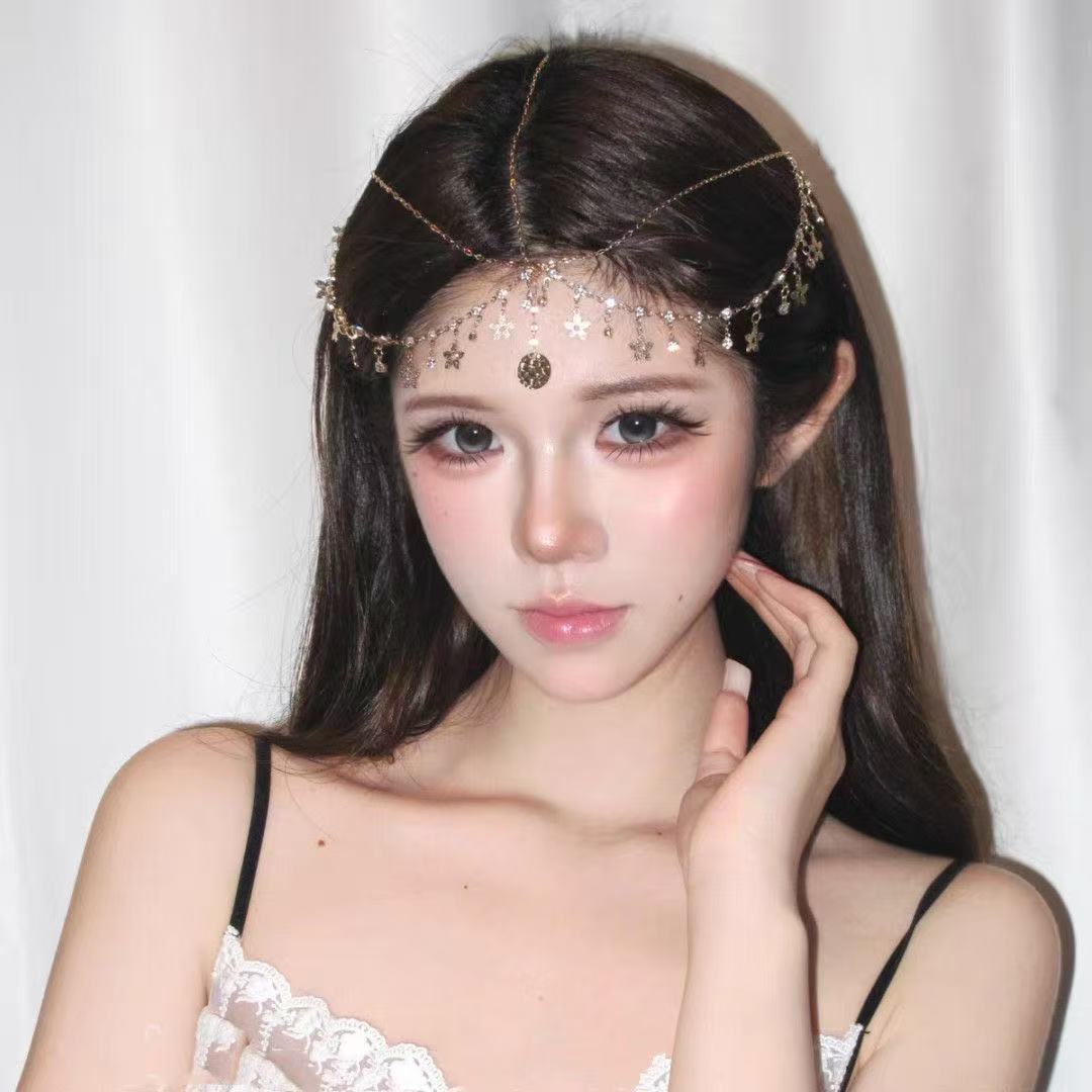 Exotic-style gold floral tiara with diamond-studded tassels, a luxurious and elegant hair accessory for photoshoots, travel, and bridal looks