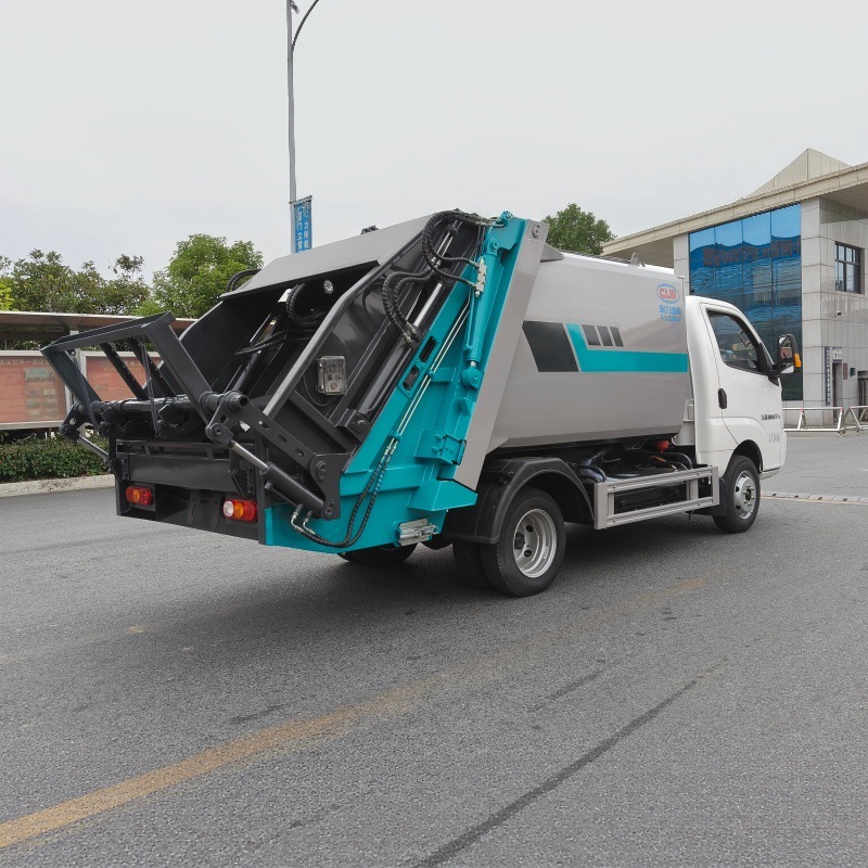 Pure electric sanitation vehicle with a sealed garbage compactor, designed for automatic compression of municipal solid waste for collection and transportation