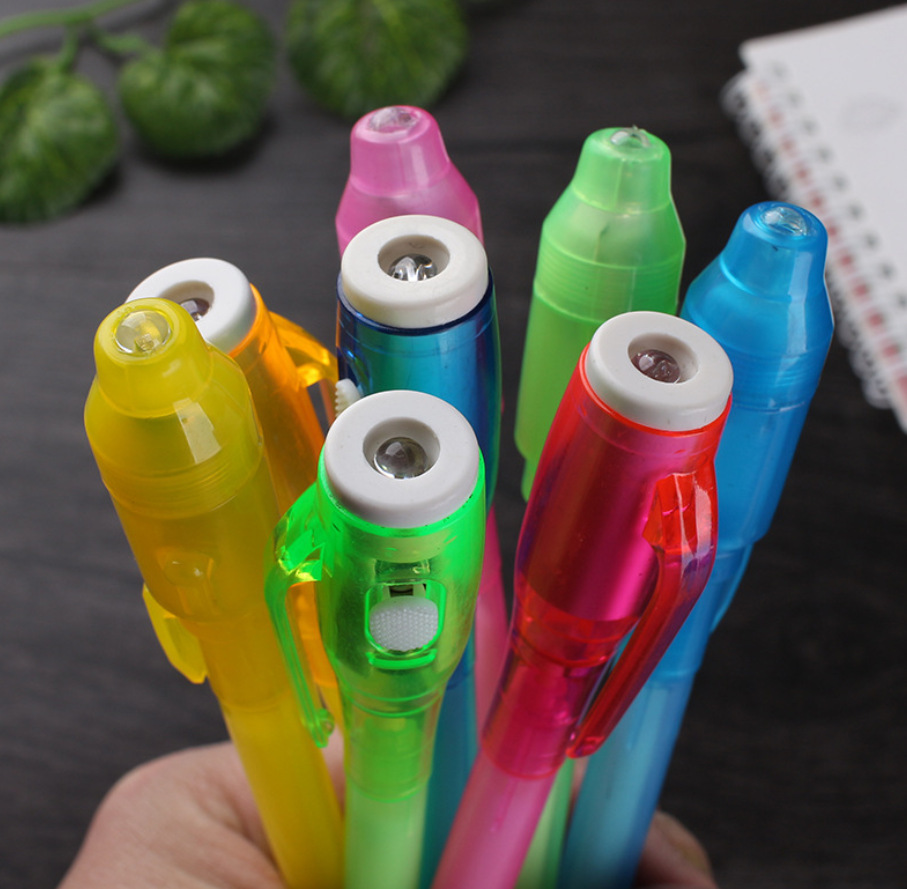 Fábrica directa UV invisible fluorescente pluma LED púrpura Optoelectrónica detector de dinero pluma creativa UV lámpara de tinta mágica pluma