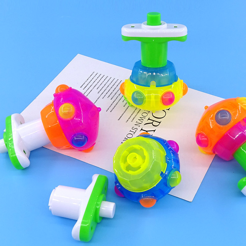 Juguetes de ocio para niños catapultados dibujos animados giroscopio luminoso colorido giroscopio eléctrico mercado nocturno tienda de venta caliente