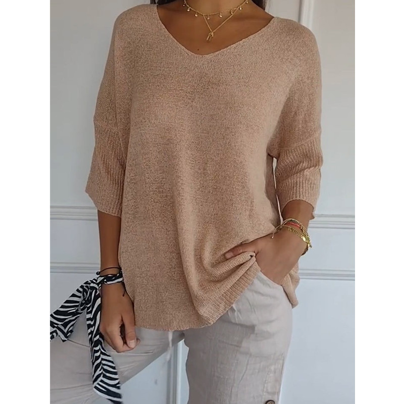 Un pull basique décontracté à col en V et manches trois-quarts, de couleur unie. C'est un sous-vêtement pour femme._voghion.com