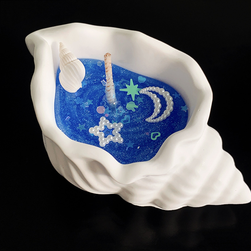 Doftljus formad som snäcka i presentförpackning för stämning_voghion.com