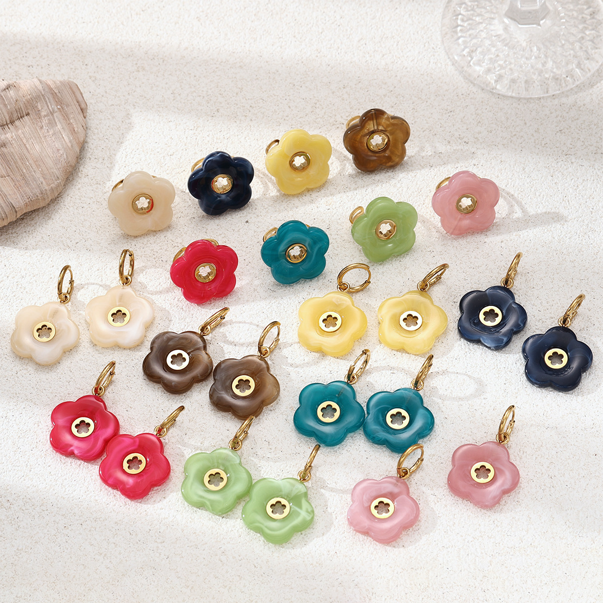 Alta Europa y América acero inoxidable ligero lujo alto sentido flores acrílico titanio joyería conjunto de aretes primavera y verano nuevos productos