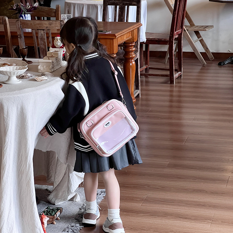 Paquete de dolor de comida de dos dimensiones japonesa 2025 nuevo paquete de hombro transparente para niños y niñas bolsas animadas de moda para niños
