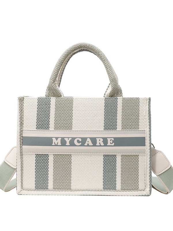 Bolso portátil de alta gama a rayas con sentido al por mayor transfronterizo logotipo personalizado nuevo casual todo-fósforo bolso de mensajero de gran capacidad