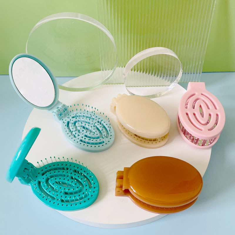 Hogar portátil de viaje cojín de aire peine hueco plegable masaje peine mini hueso contar peine pequeño con espejo al por mayor