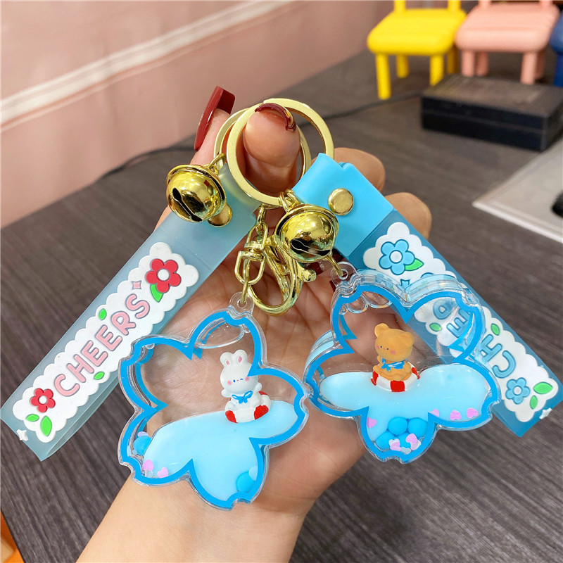 Creative Navy style cherry blossom bear floating bottle keychain female cute quicksand bottle pendant couple backpack ornaments