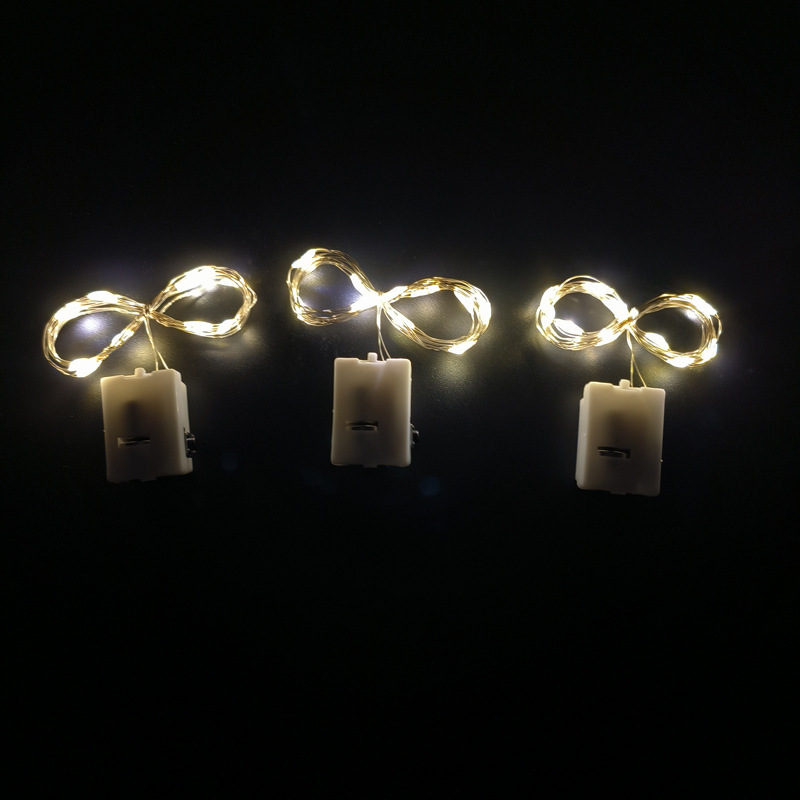 65000810 led铜线小白盒灯串-1米10灯 暖白