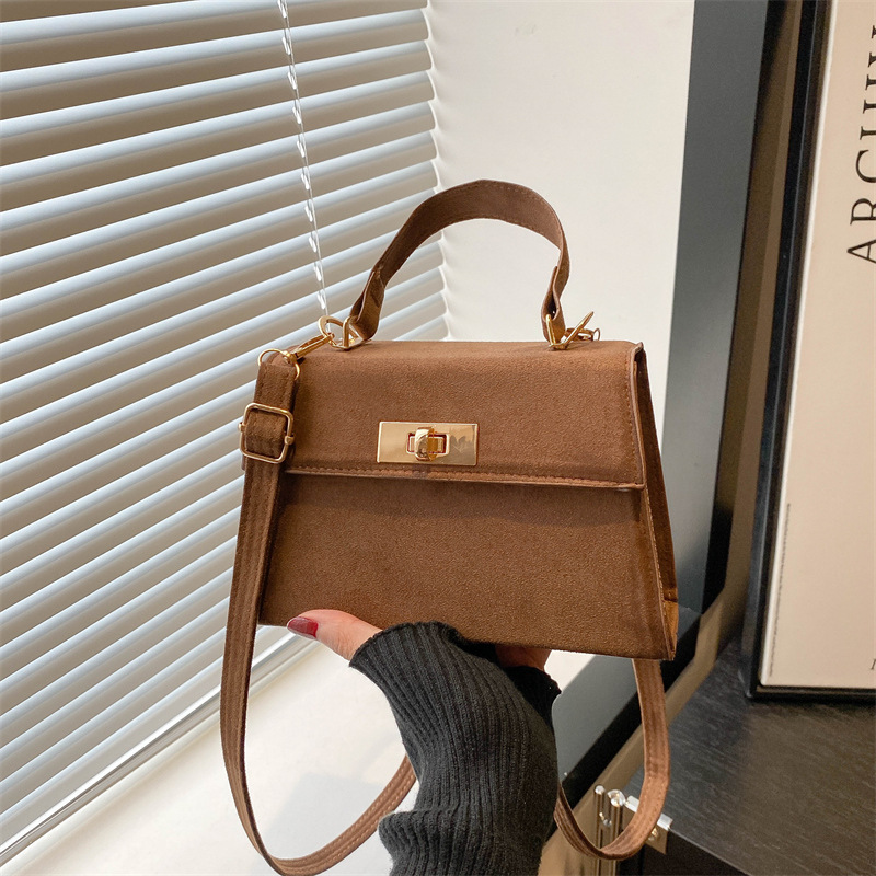 2025 primavera nueva moda simple bolso de mano de cerradura de viaje bolso de hombro retro estilo coreano bolso de mochila pequeña