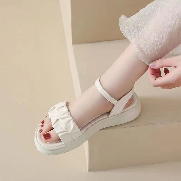 Sandalias para mujer para llevar verano nuevo estilo 2025 salvaje estilo de hada plana con falda sandalias de una palabra con zapatos de mujer romana