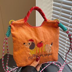 日系刺繍かわいいソーセージ犬バケツバッグ女性2025夏の新型携帯バッグ通勤シングルショルダーバッグ