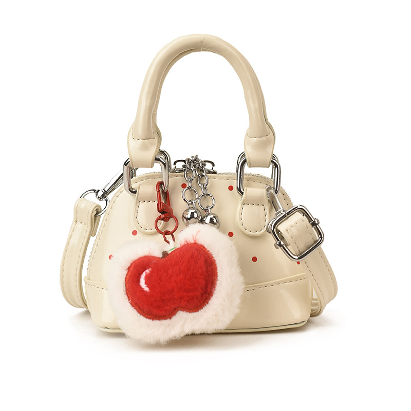 Bolsas coreanas para niños y niñas, bolsas de conchas, bolsas de mano de manzana, bolsas para niños, bolsas de comercio exterior transfronterizas 2026
