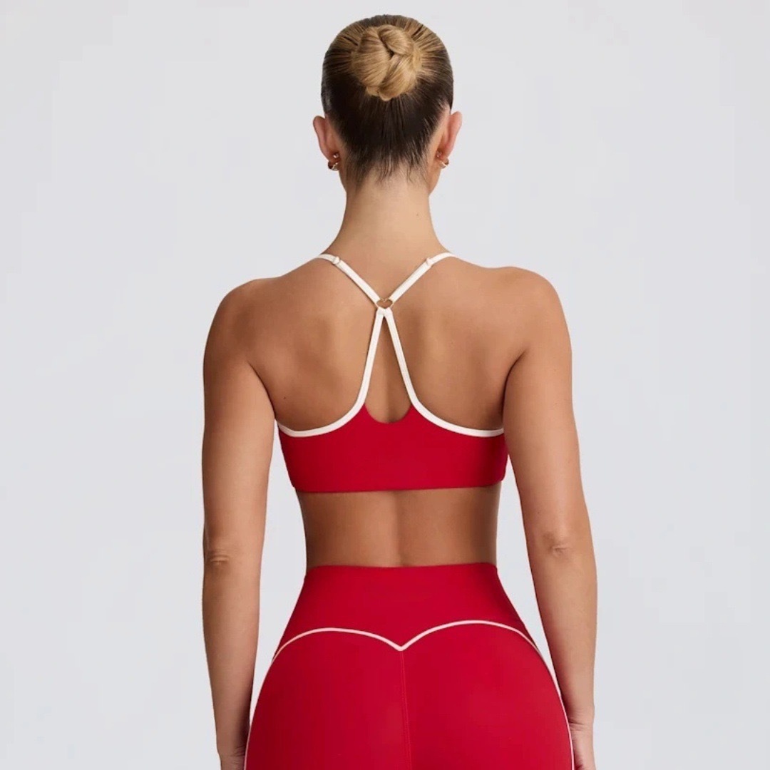 Procesamiento personalizado OEM comercio exterior europeo y americano transfronterizo belleza espalda deporte contraste color sujetador melocotón cadera alta cadera elástica pantalones de yoga