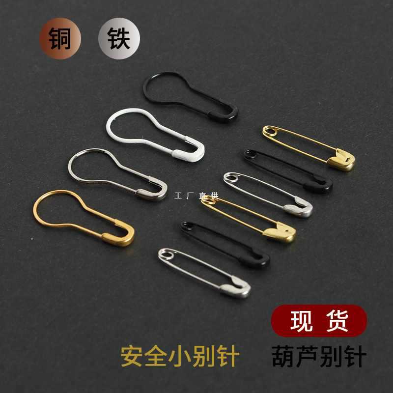 Golden black white pin