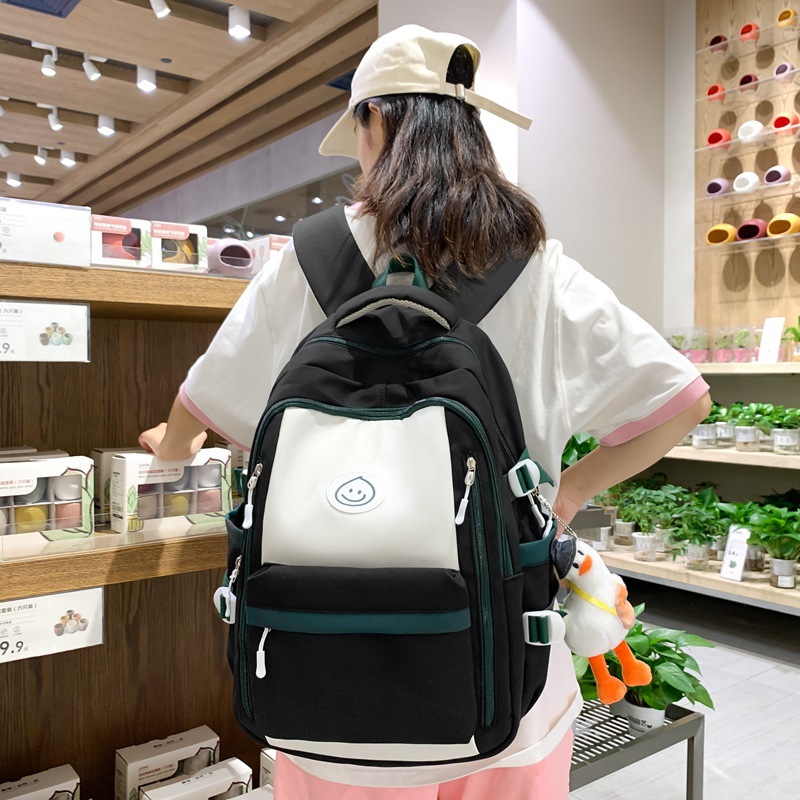 Mochila de lona coreana simple y versátil para mujeres 2023 nueva bolsa de gota de lluvia de gran capacidad mochila de ocio mochila de estudiantes
